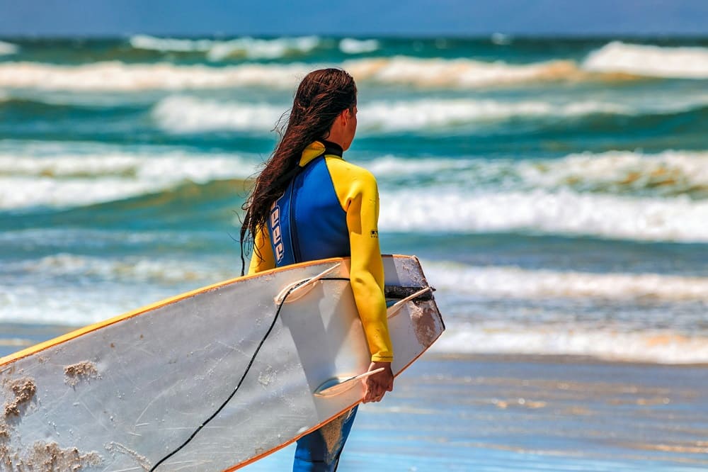 Girl with surfboard.